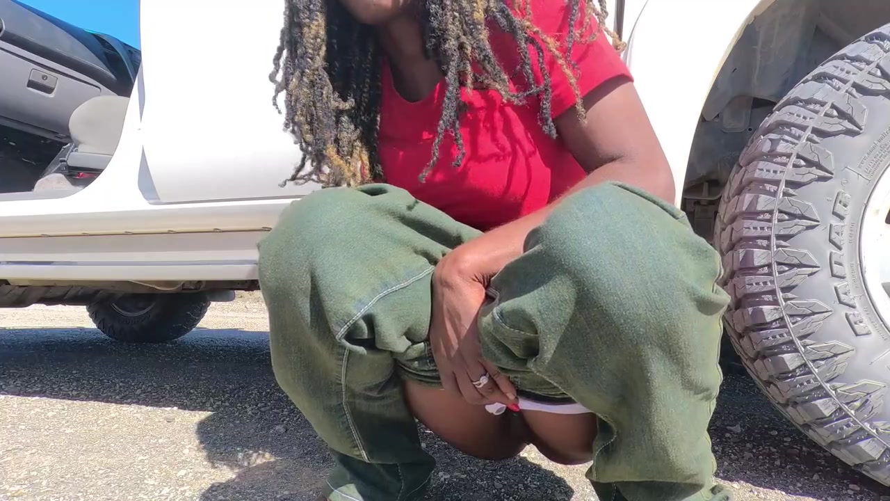 Ebony MILF pisses next to the road and gets her pussy licked